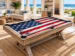 Close-up view of American flag custom pool table felt showing the printed cloth texture, pool table rails, corner pocket, cue sticks, and billiard balls.