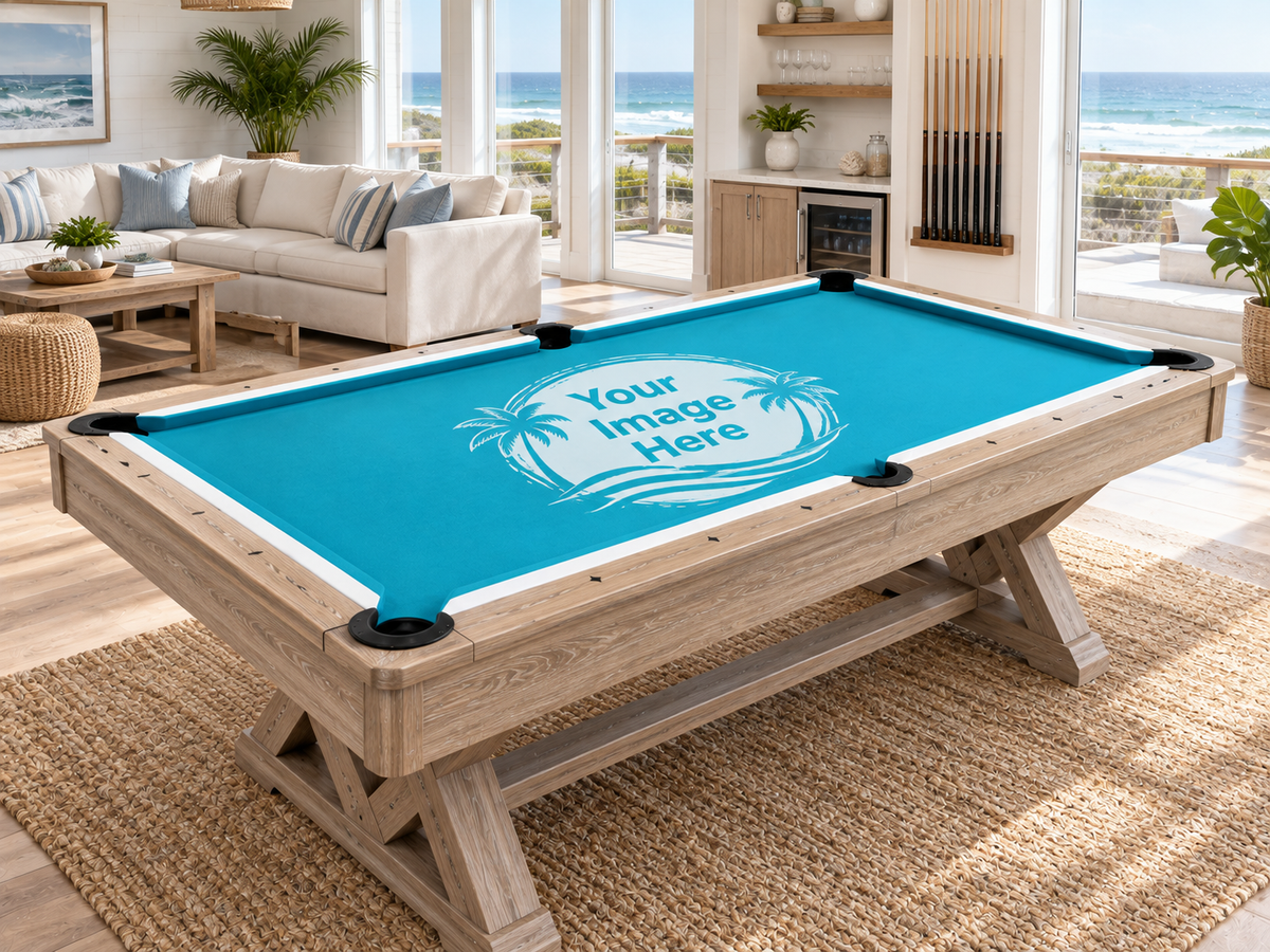 custom pool table felt displayed on a wood billiards table in a bright upscale game room with mountain and lake views.