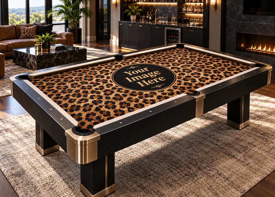 Close-up view of leopard print custom pool table felt showing detailed cloth texture, corner pocket, cue stick, and billiard balls on a premium pool table.